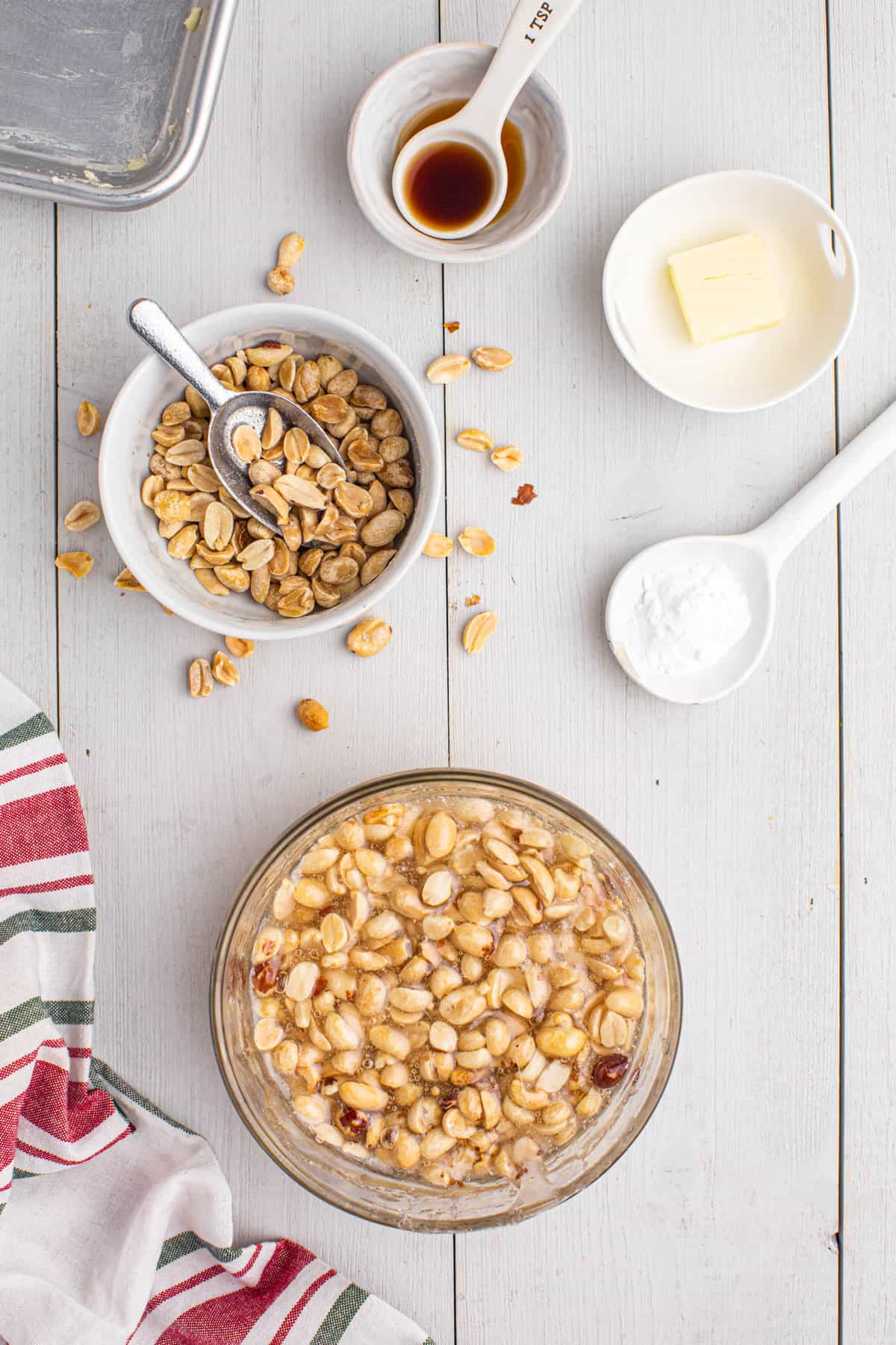 Peanuts and syrup in bowl for peanut brittle