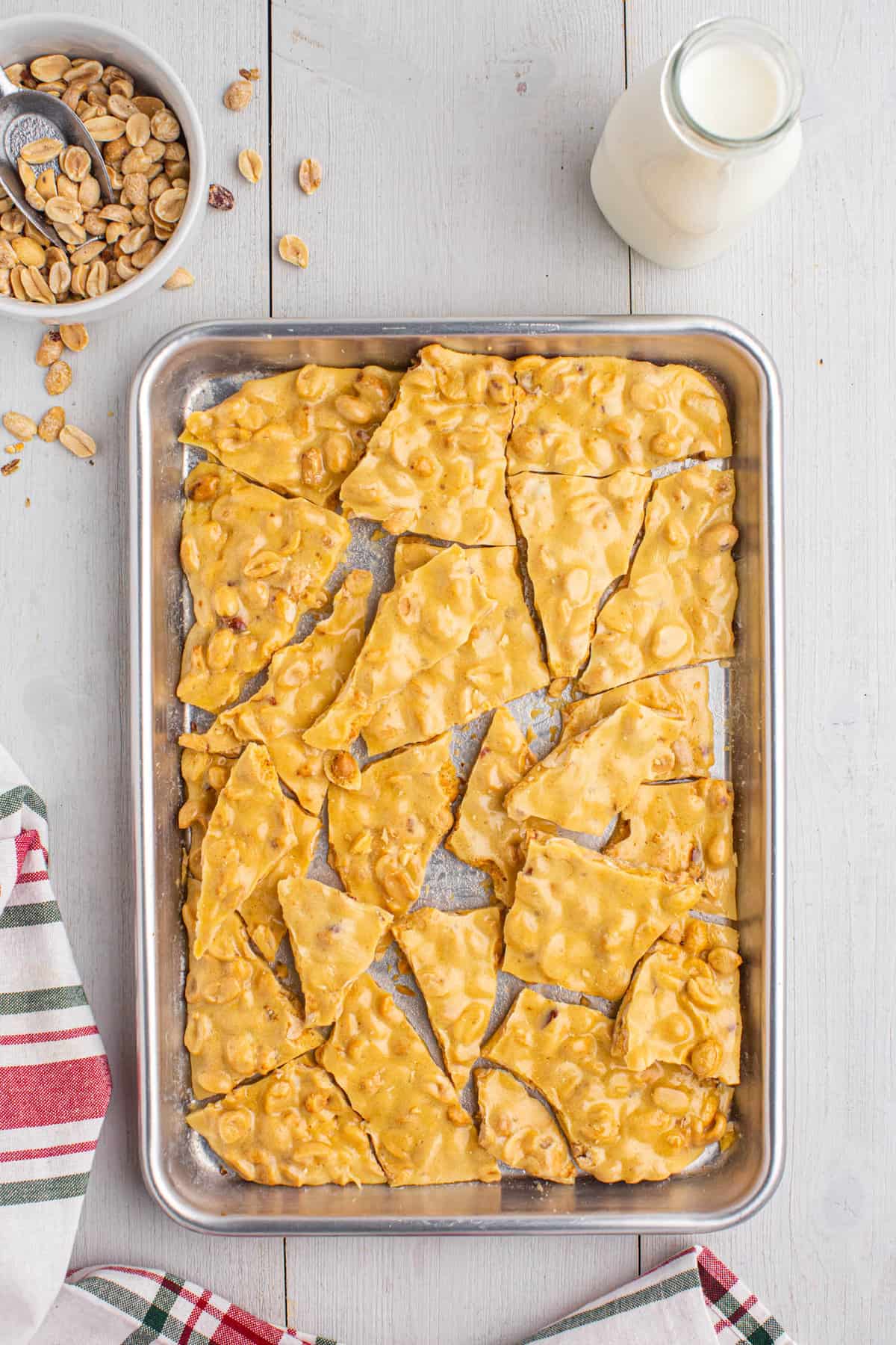 Peanut Brittle in pieces on baking sheet