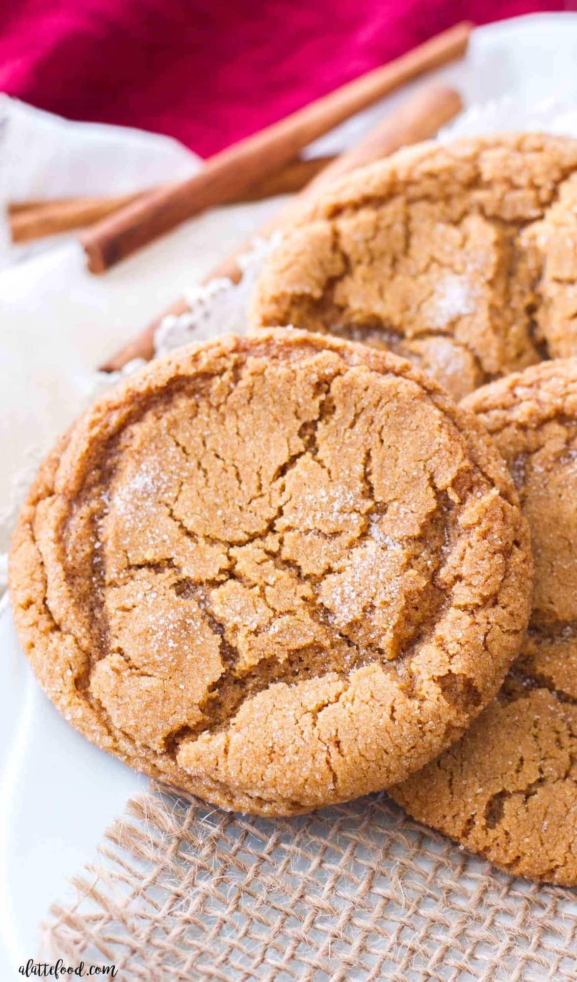 A plate of molasses cookies on a white plate. 