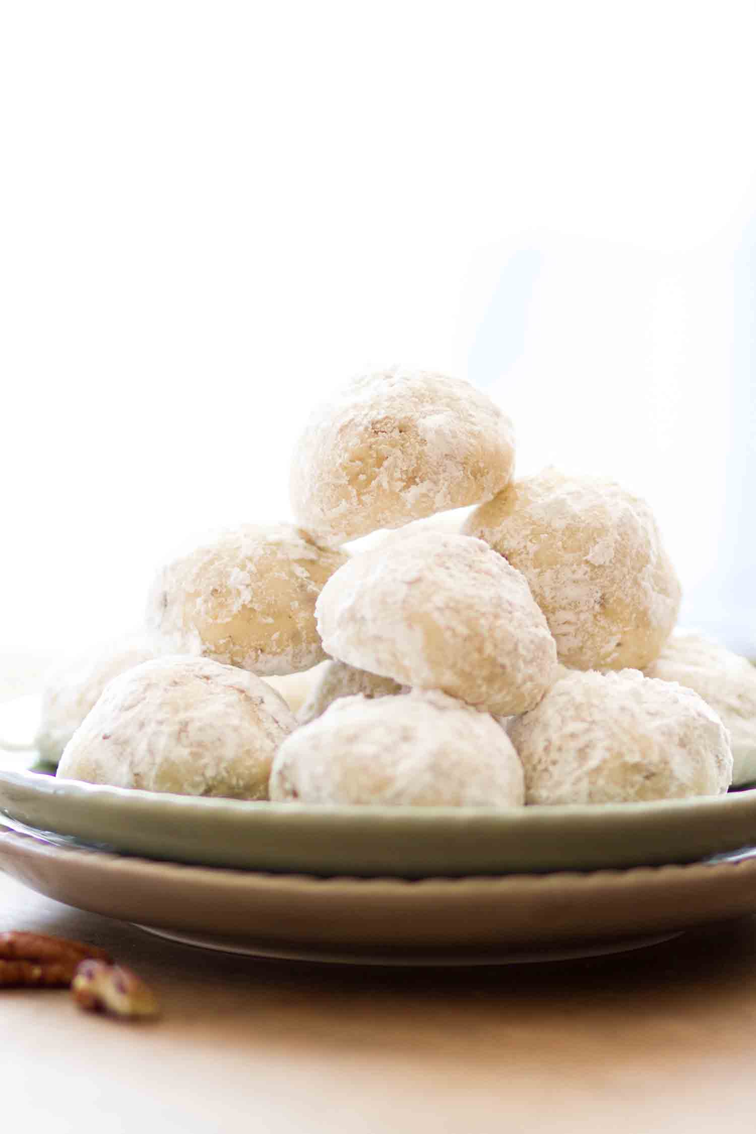 Mexican wedding cake cookies piled high on a plate.