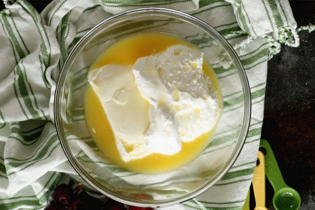 Overhead image of cream cheese, marshmallow creme and orange juice