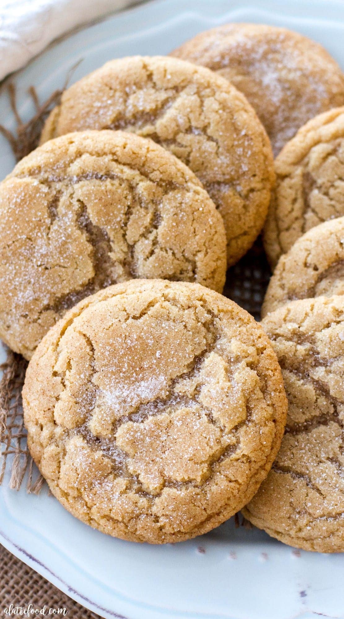 Snickerdoodle cookies on a green plate.