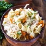 crockpot chicken noodle soup in brown bowl