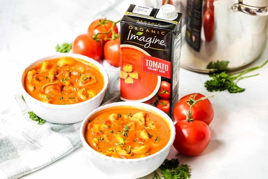 Two bowls of tortellini tomato soup