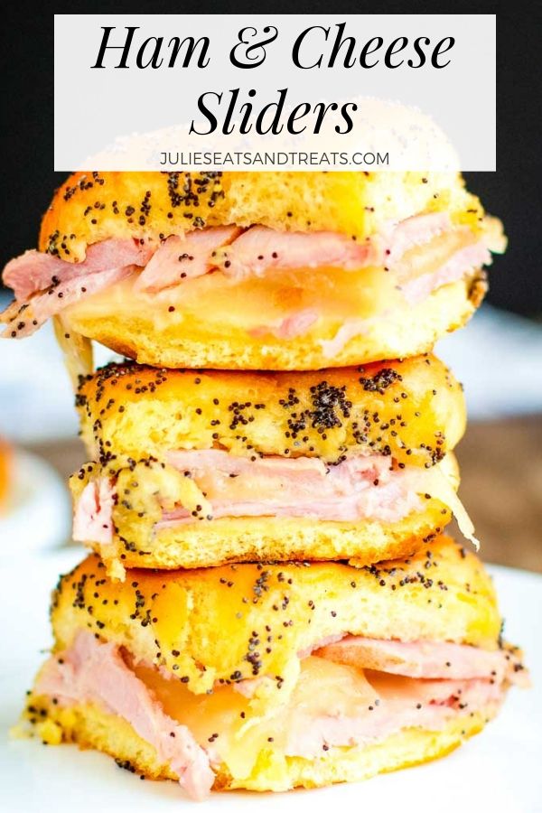 Three Ham and cheese sliders stacked on a plate