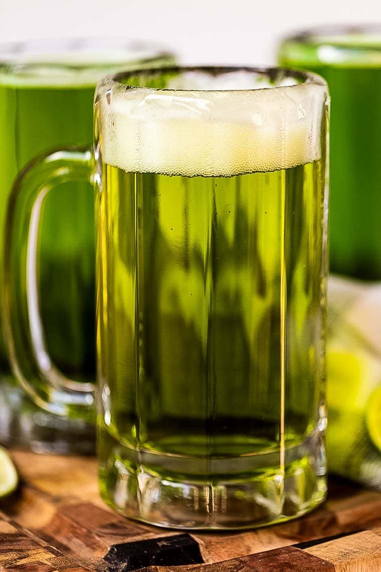 Close up of Beer in Mug with head that has been dyed green