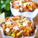 Two white bowls of pork chili