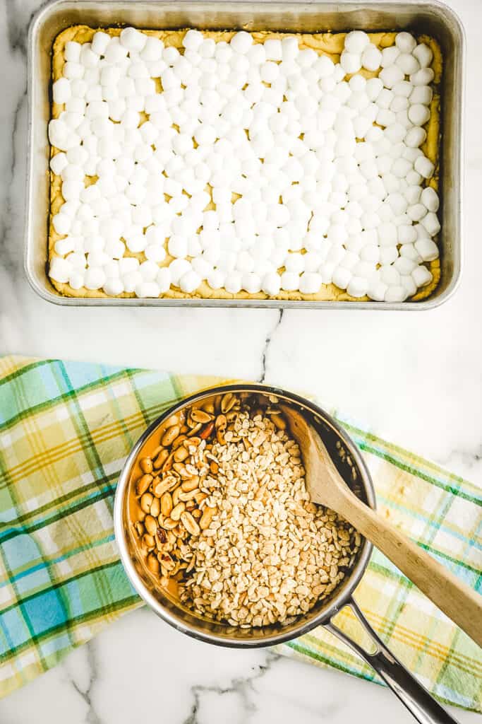 Overhead image of saucepan with melted peanut butter mixture and Rice Krispies