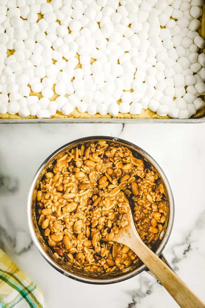 Overhead image of saucepan with melted peanut butter mixture and Rice Kripsies combined