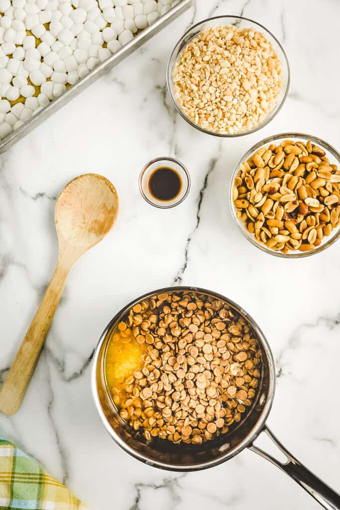 Overhead image of saucepan with ingredients to melt for peanut butter mixture