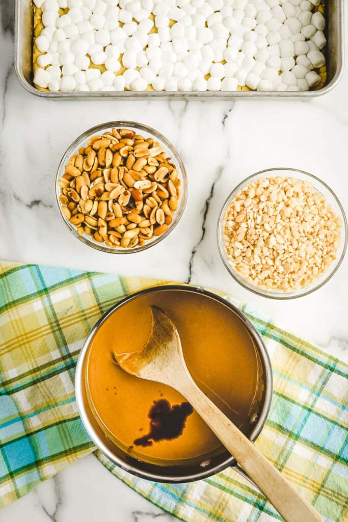 Overhead image of saucepan with melted peanut butter mixture and vanilla