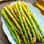 Grilled asparagus on a blue plate