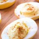 Smoked deviled eggs on a cutting board