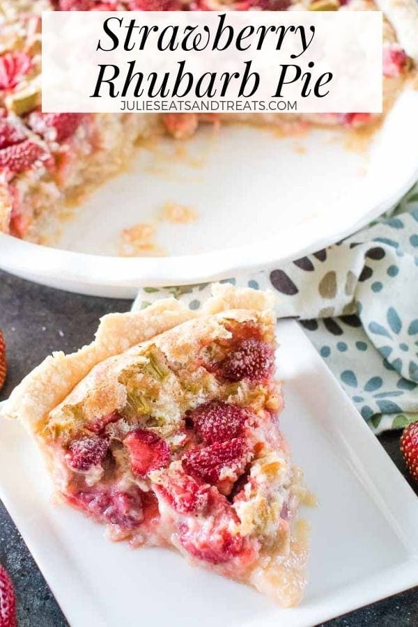 Slice of strawberry rhubarb pie on a white plate