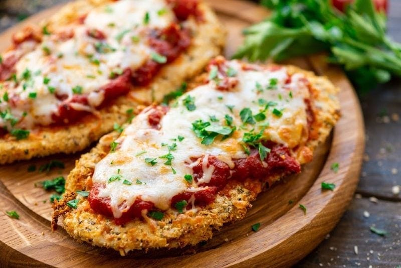 Air Fryer Chicken Parmesan on brown board