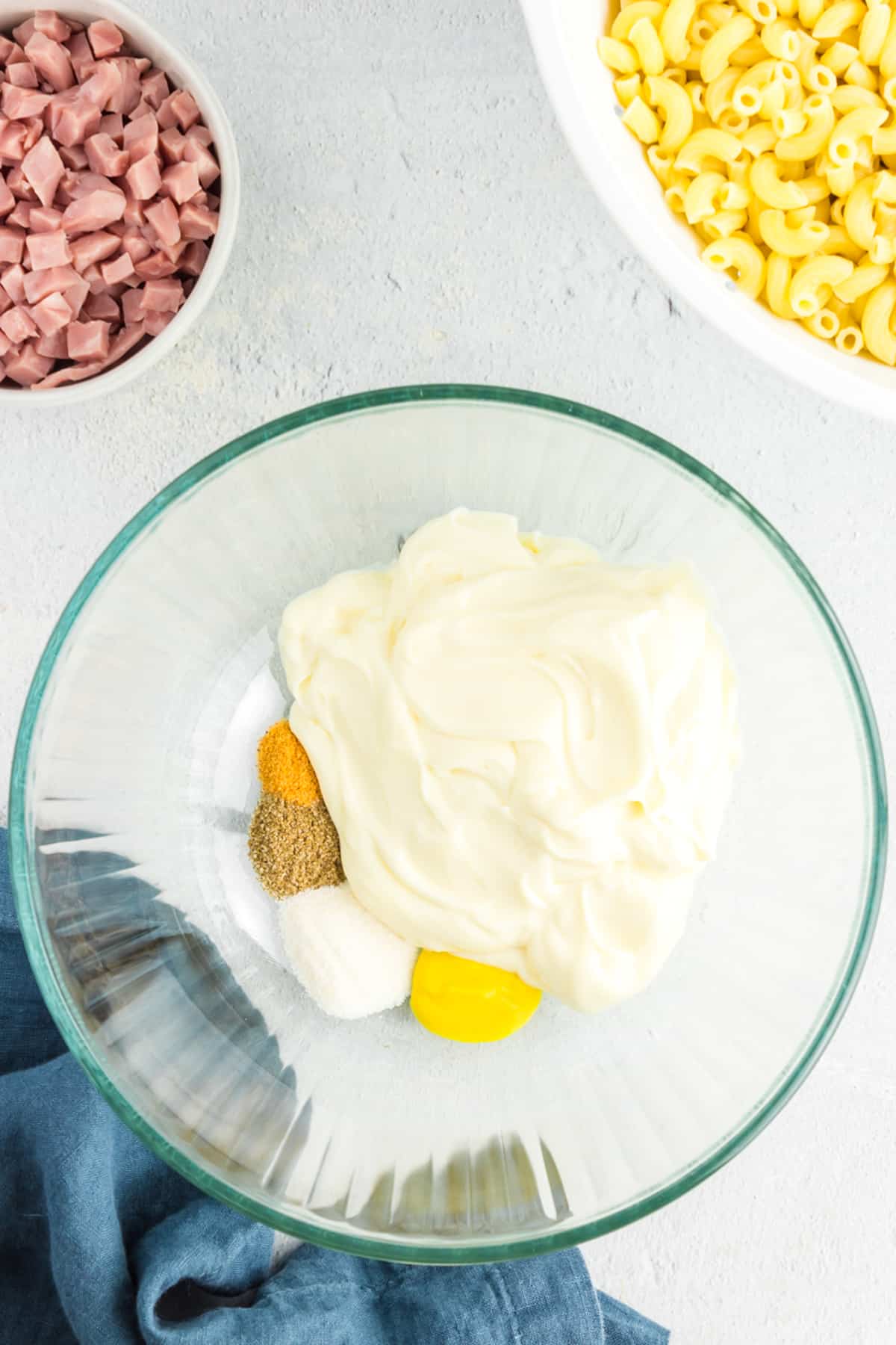 Bowl with ingredients for pasta salad dressing