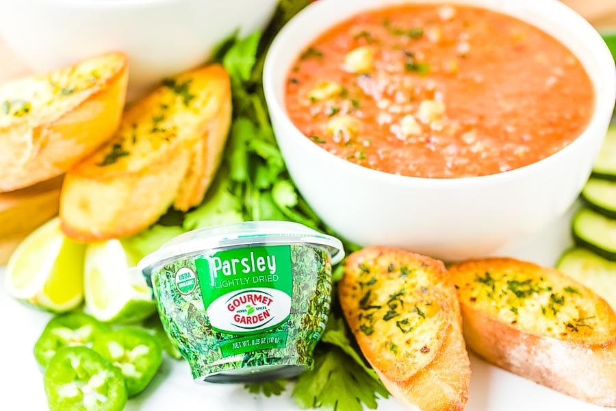 Gazpacho Soup in white bowl with ingredients