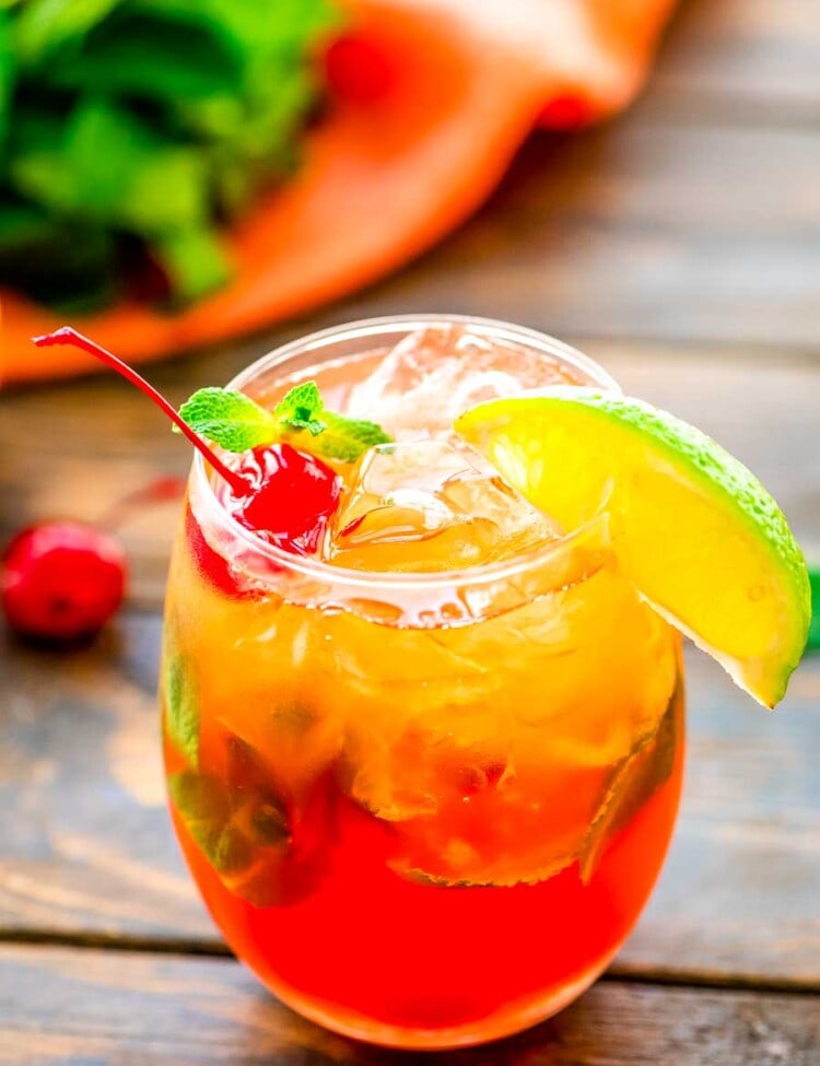 Mai Tai Drink in glass with a lime wedge and cherry