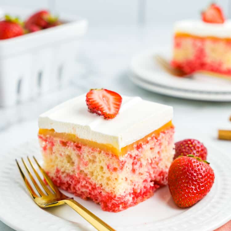 A piece of Strawberry Poke Cake on Plate