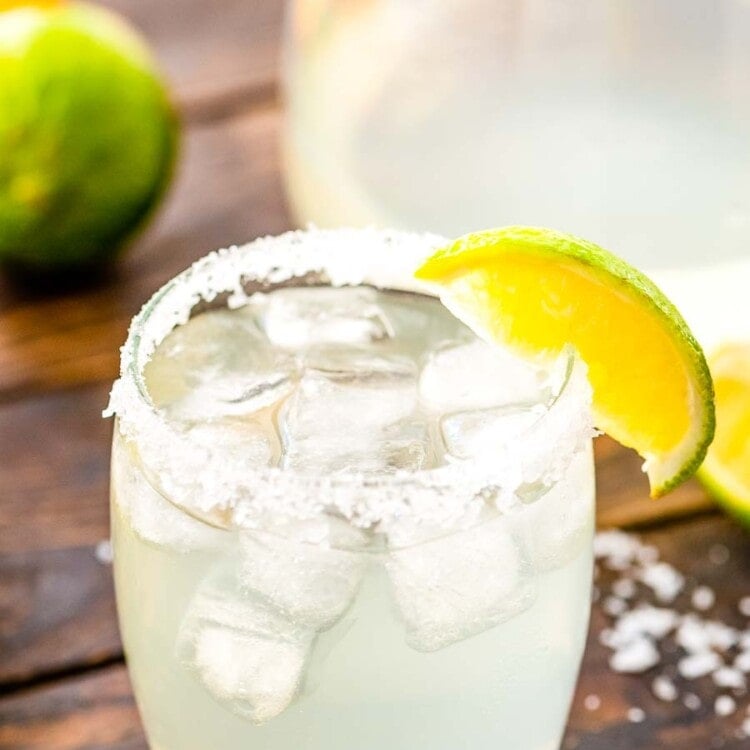 Margarita in a glass with salt and lime wedge on the rim