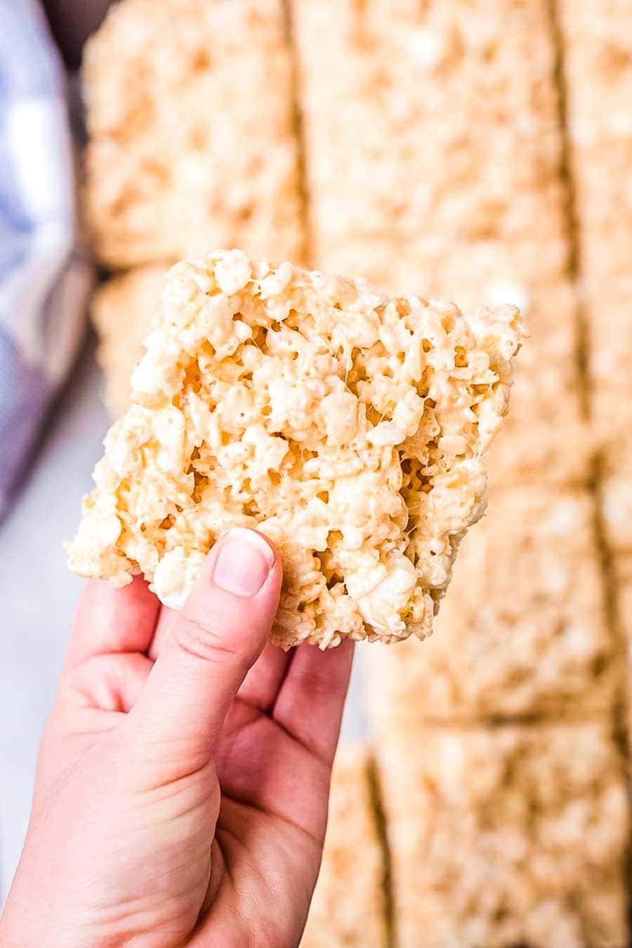 rice krispie treats bar in hand