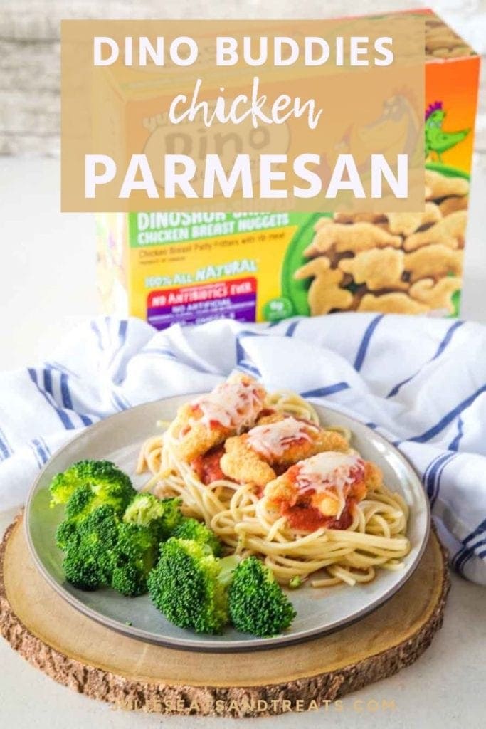 Dino buddies chicken parmesan over pasta with broccoli on a white plate