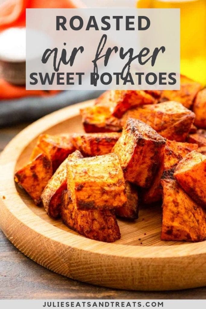 Roasted air fryer sweet potatoes on a wood plate