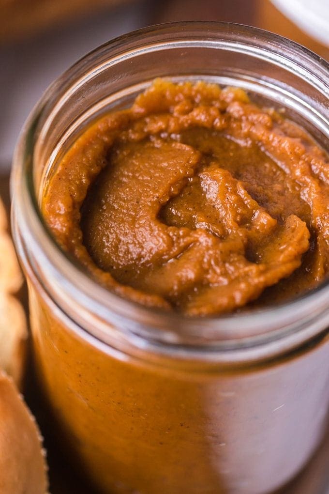 Close up image of pumpkin butter in a glass jar