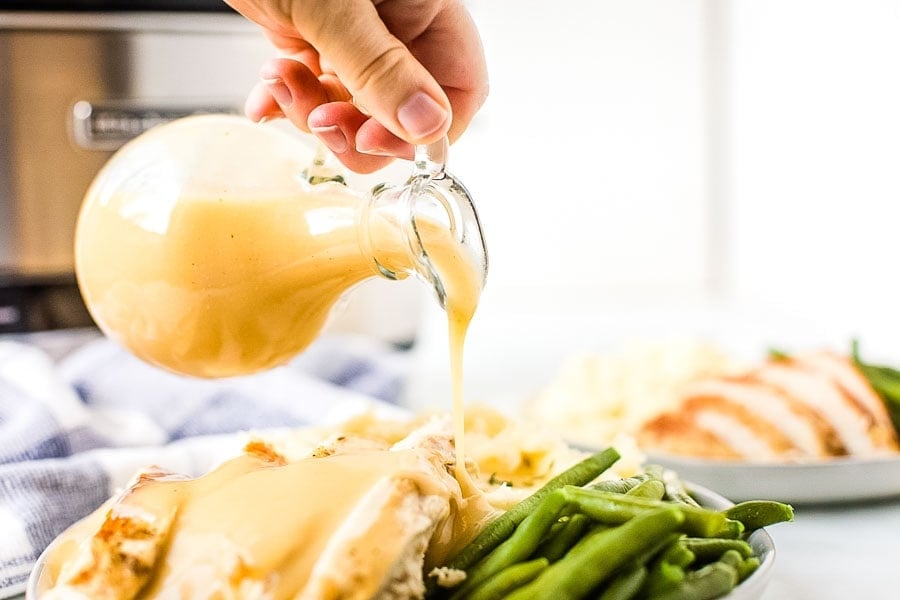 Gravy being poured over turkey