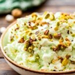 Bowl of watergate salad topped with pistachio