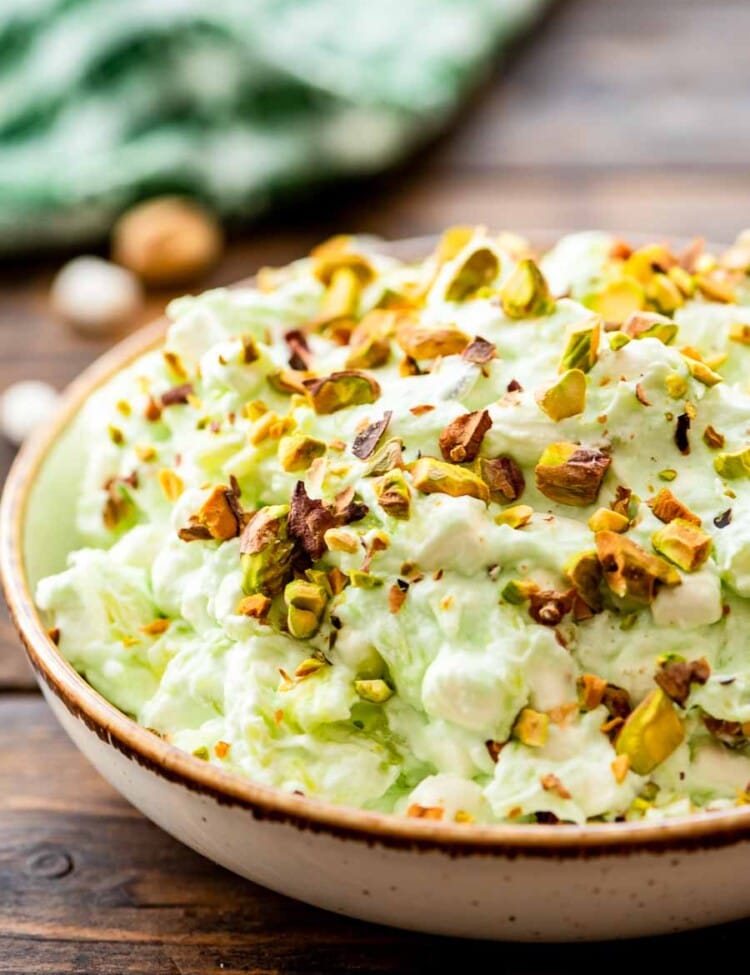 Bowl of watergate salad topped with pistachio