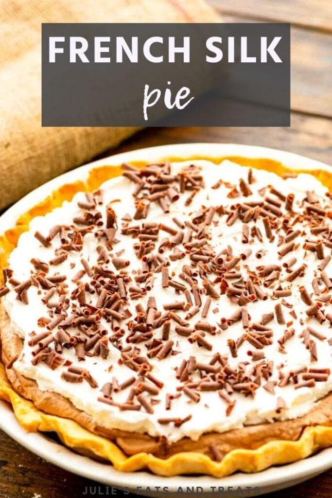 Whole french silk pie topped with chocolate shavings in a pie plate