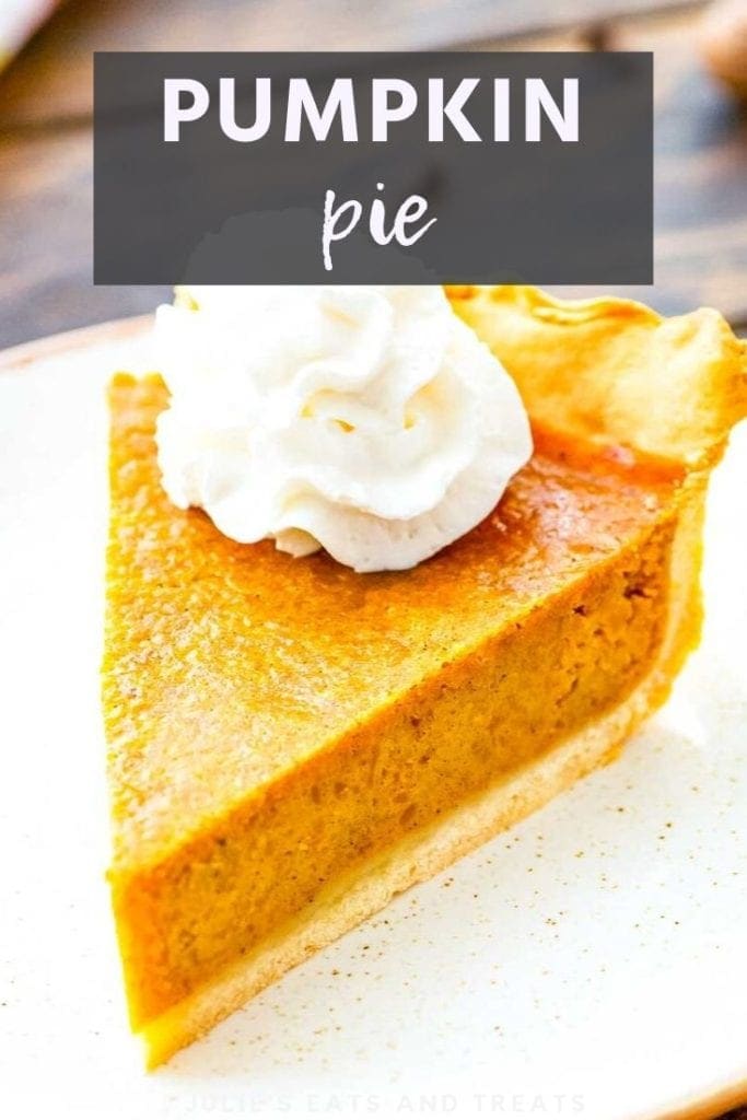 A slice of pumpkin pie on a white plate topped with whipped cream