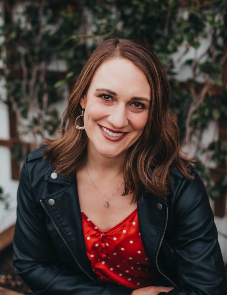 Photo of Julie in a red top and black jacket