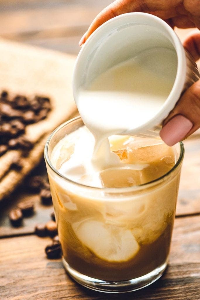 Cream being poured into White Russian