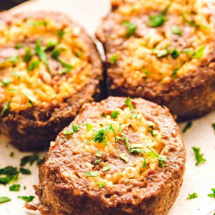 Plate with three pinwheel meatloaves on it