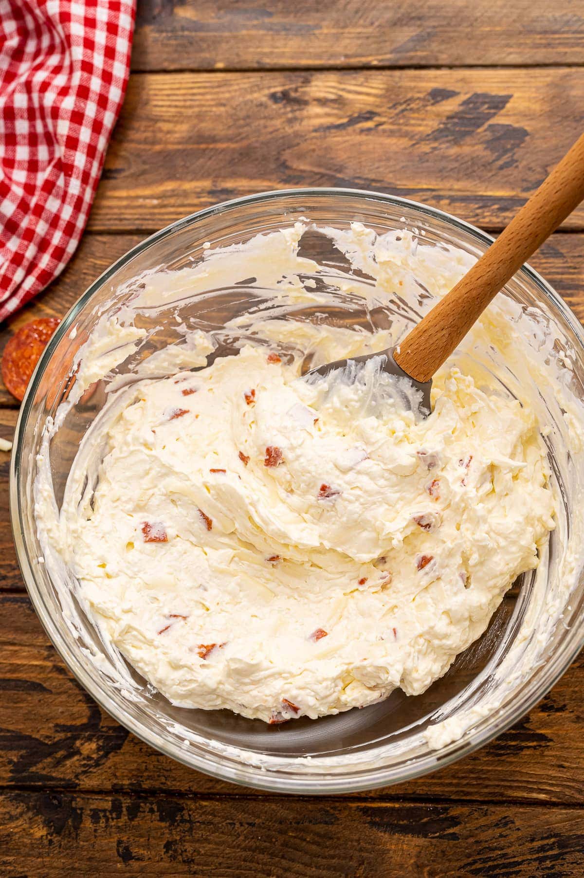 Glass bowl with mixed up pizza dip