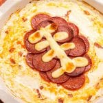 Overhead image of football pepperoni pizza dip in pie plate.