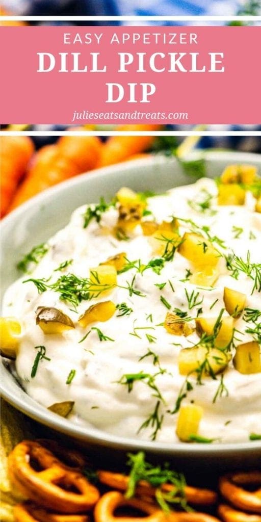 Dill Pickle Dip topped with dill in a bowl surrounded by pretzels and carrots