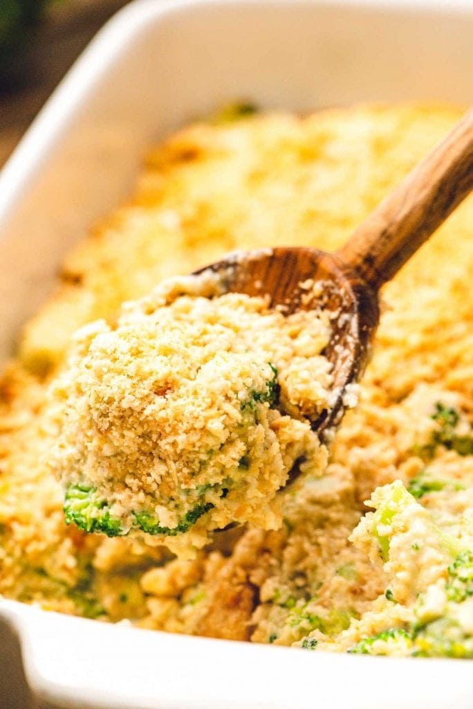 Wooden spoon with broccoli casserole