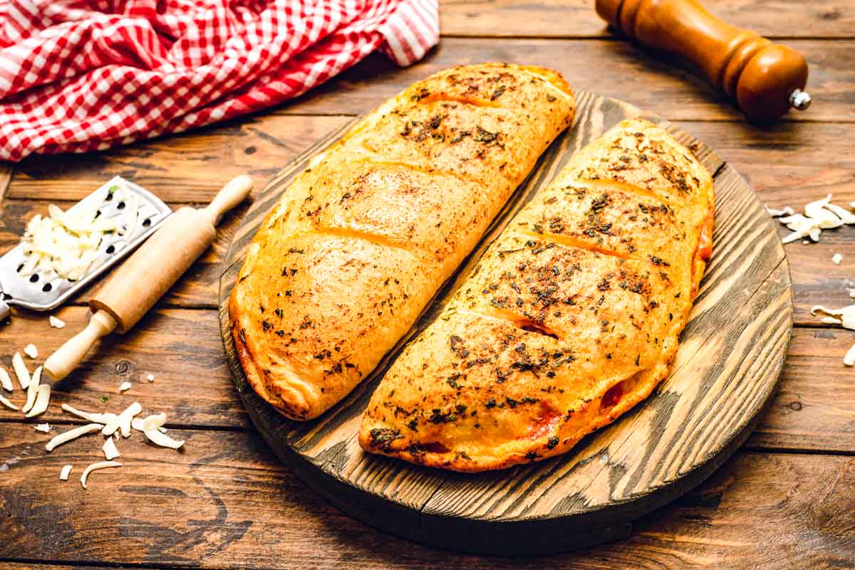 Calzones on cutting board