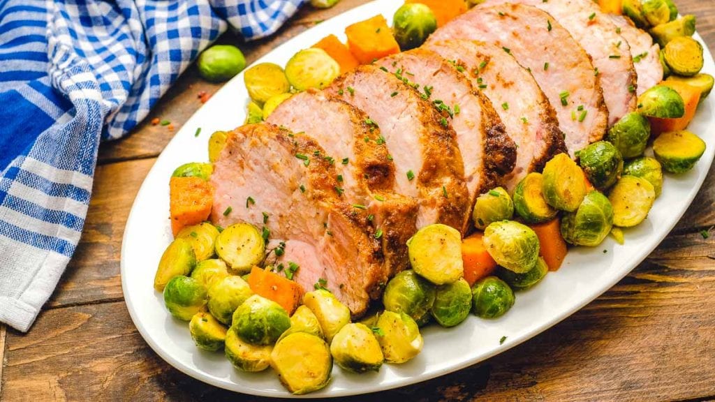 Pork Loin Roast and vegetables on white platter