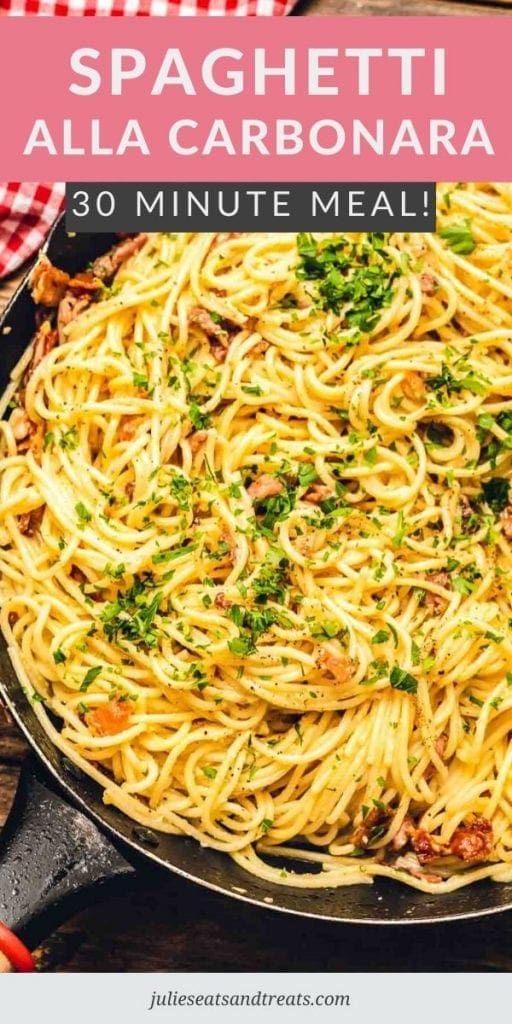 Skillet of spaghetti alla carbonara topped with parsley