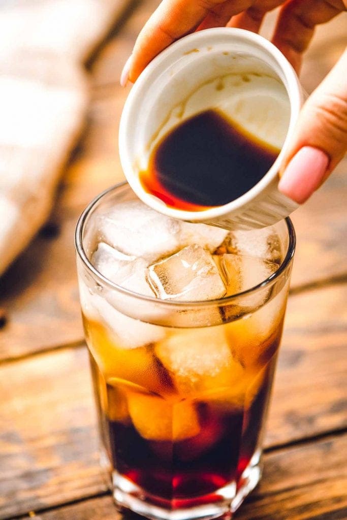 Pouring Coffee Liqueur into glass