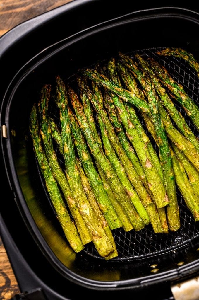 Roasted Asparagus in black air fryer basket