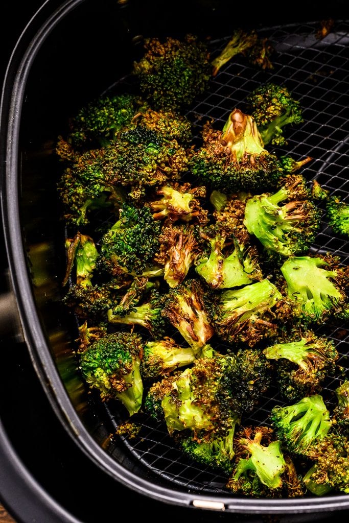 Air Fryer basket with roasted broccoli