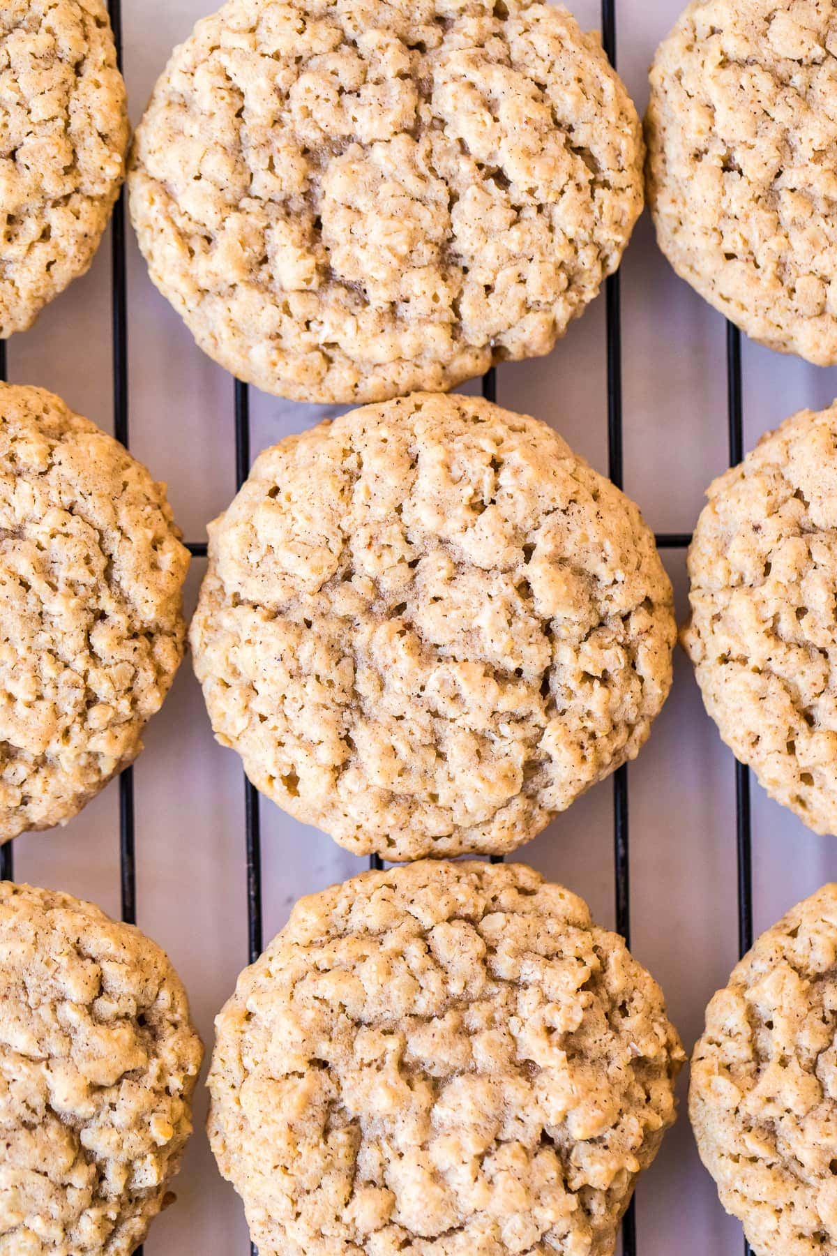 Oatmeal Cookies on wire rack with parchment paper under it