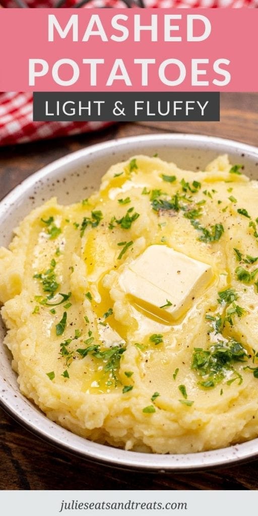 Mashed Potatoes topped with butter and parsley in a white bowl