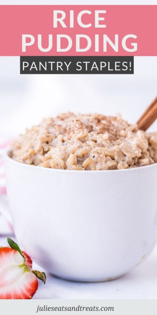 Rice Pudding in a white small bowl with a strawberry on the side