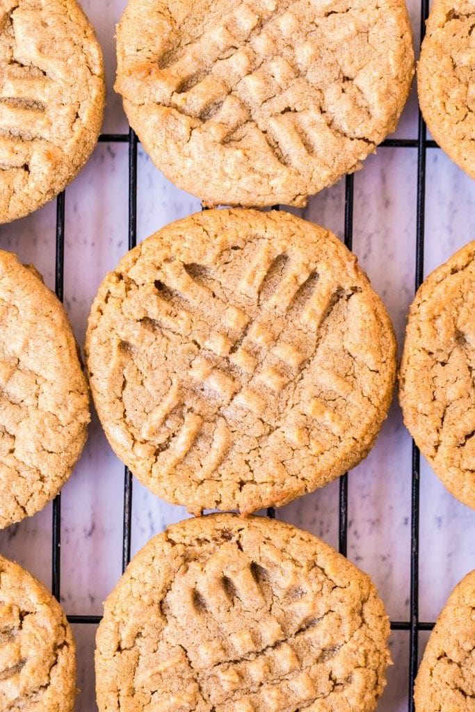 Peanut Butter Cookies on cooling rack with criss crosses on top